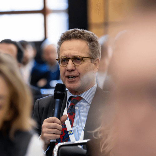 A man asks a question in the conference